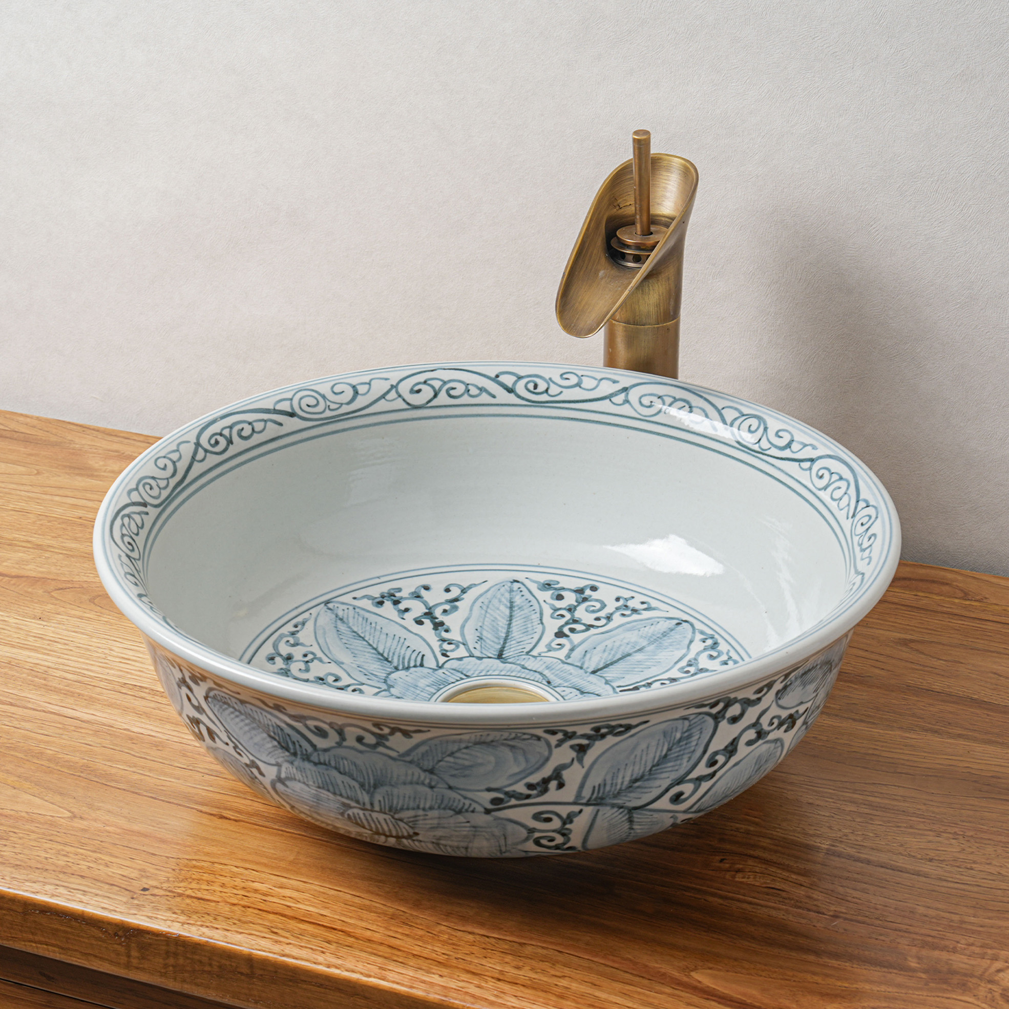 Round hand-painted ceramic washbasin