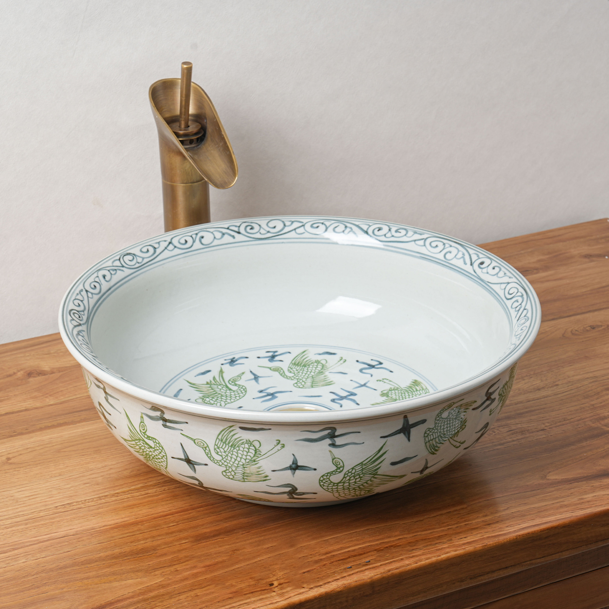 Round hand-painted ceramic washbasin