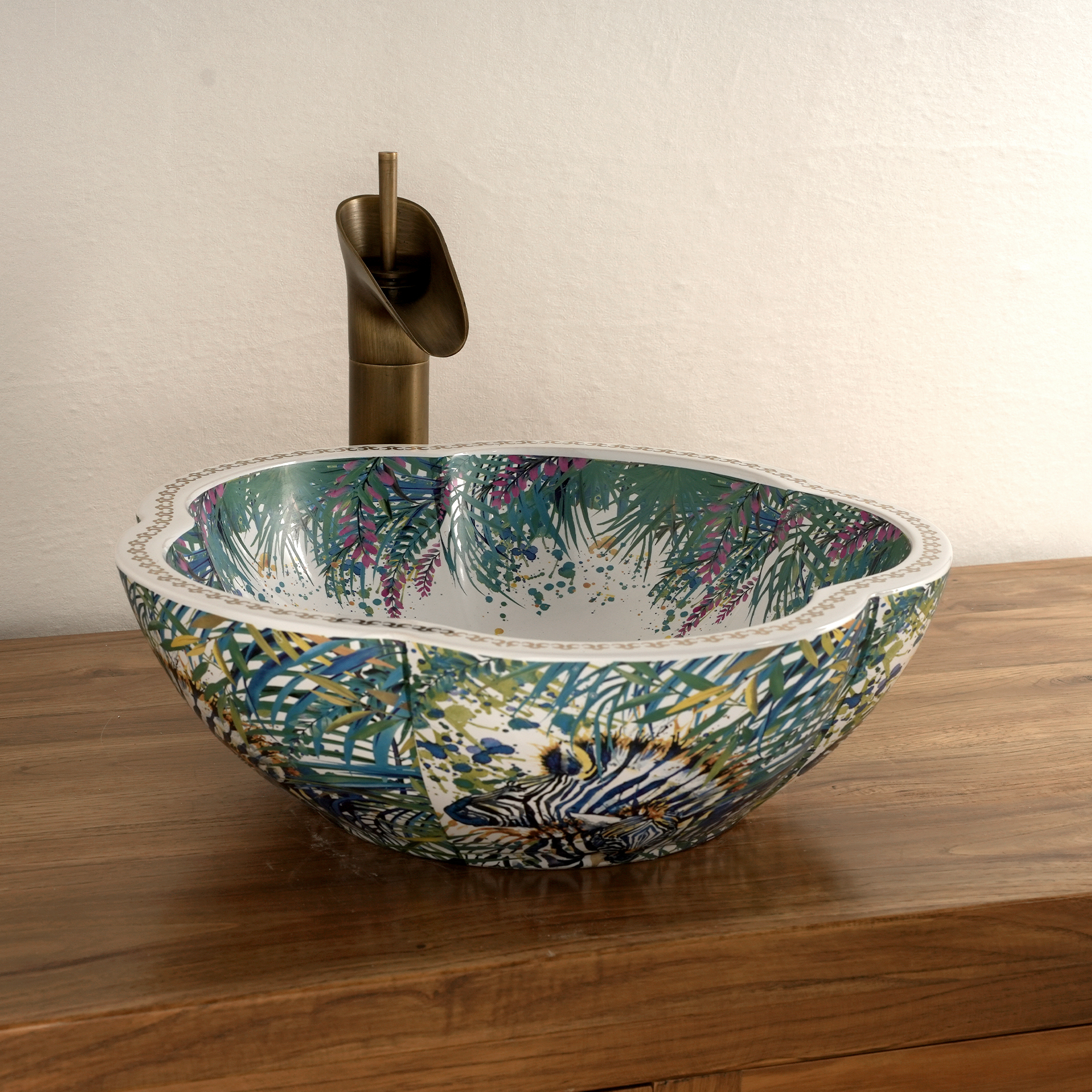 Ceramic washbasin with a green and white floral print