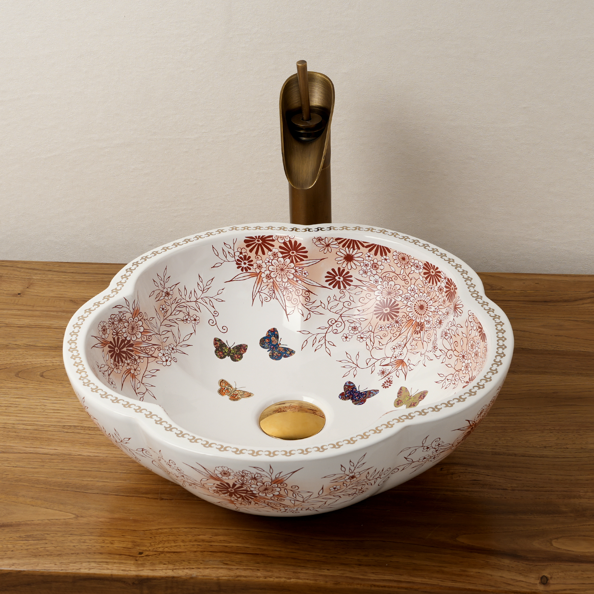 Ceramic washbasin with a pink and white floral print