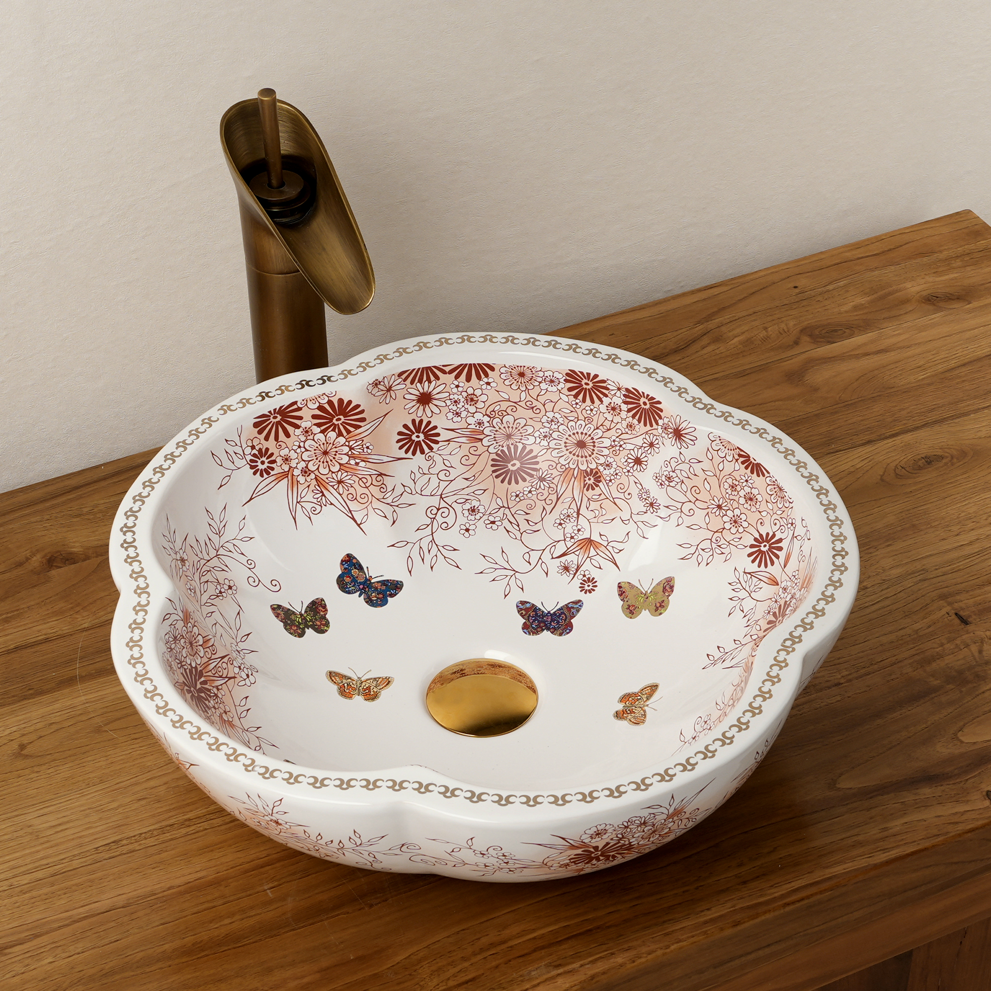 Ceramic washbasin with a pink and white floral print