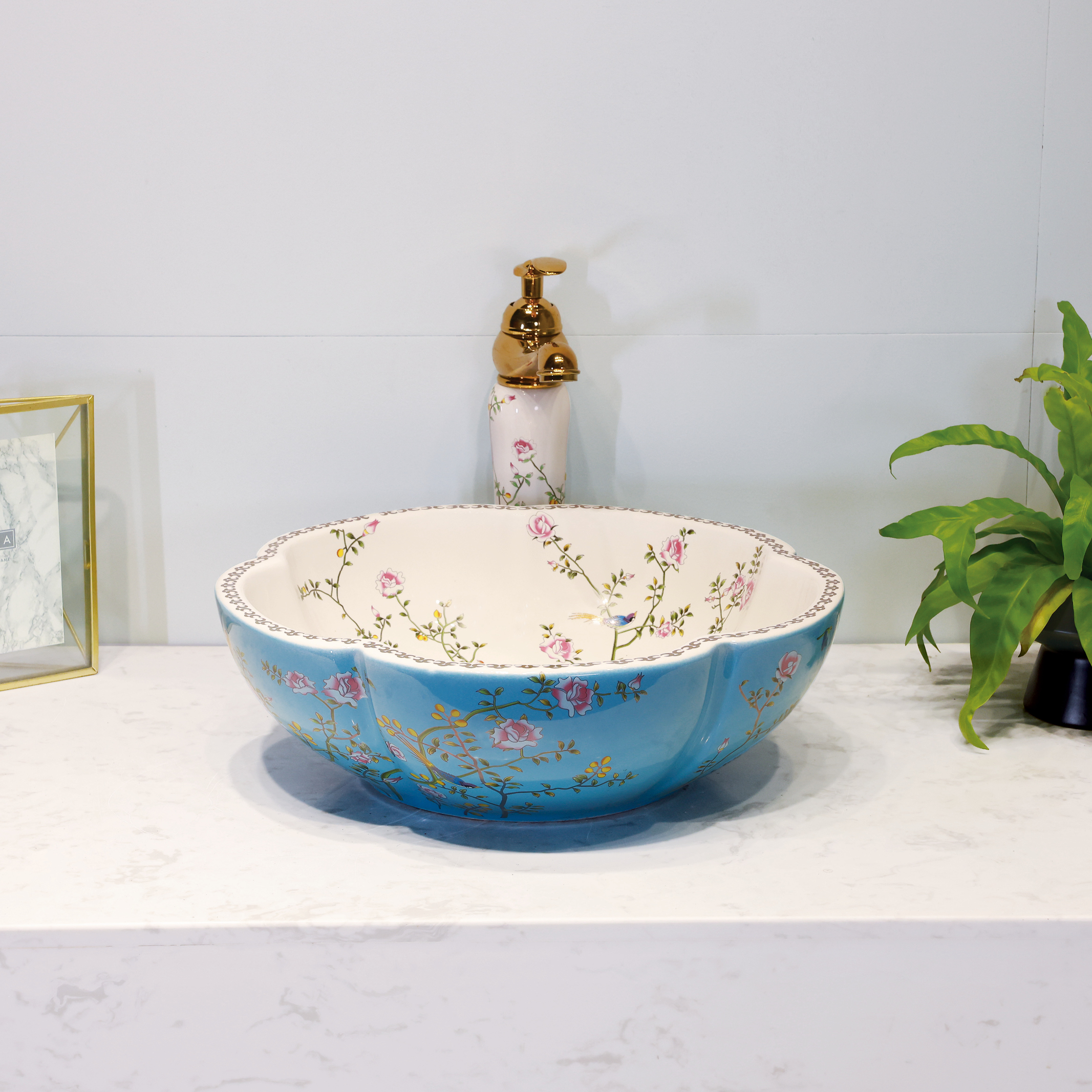 Ceramic washbasin with blue and white floral print