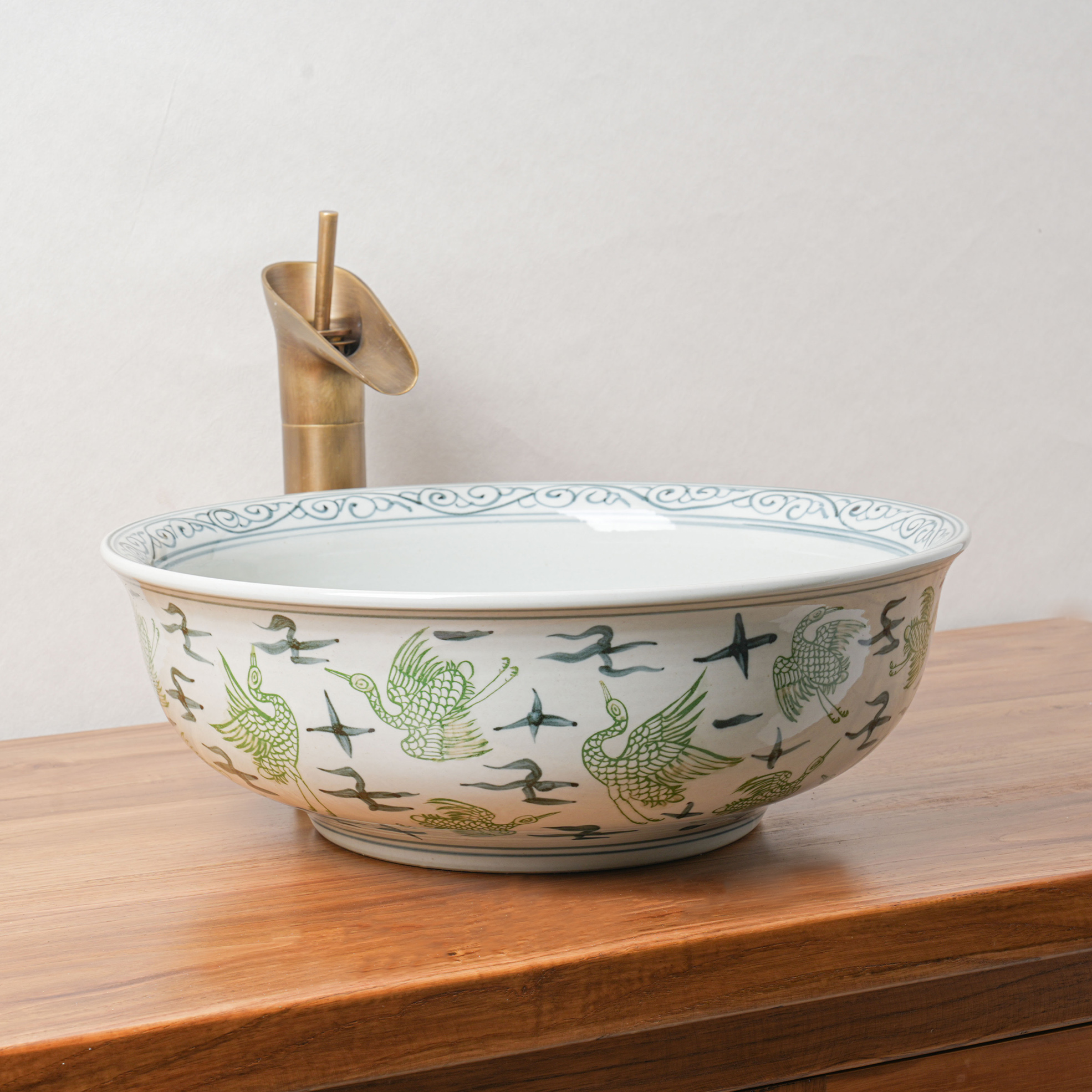 Round hand-painted ceramic washbasin