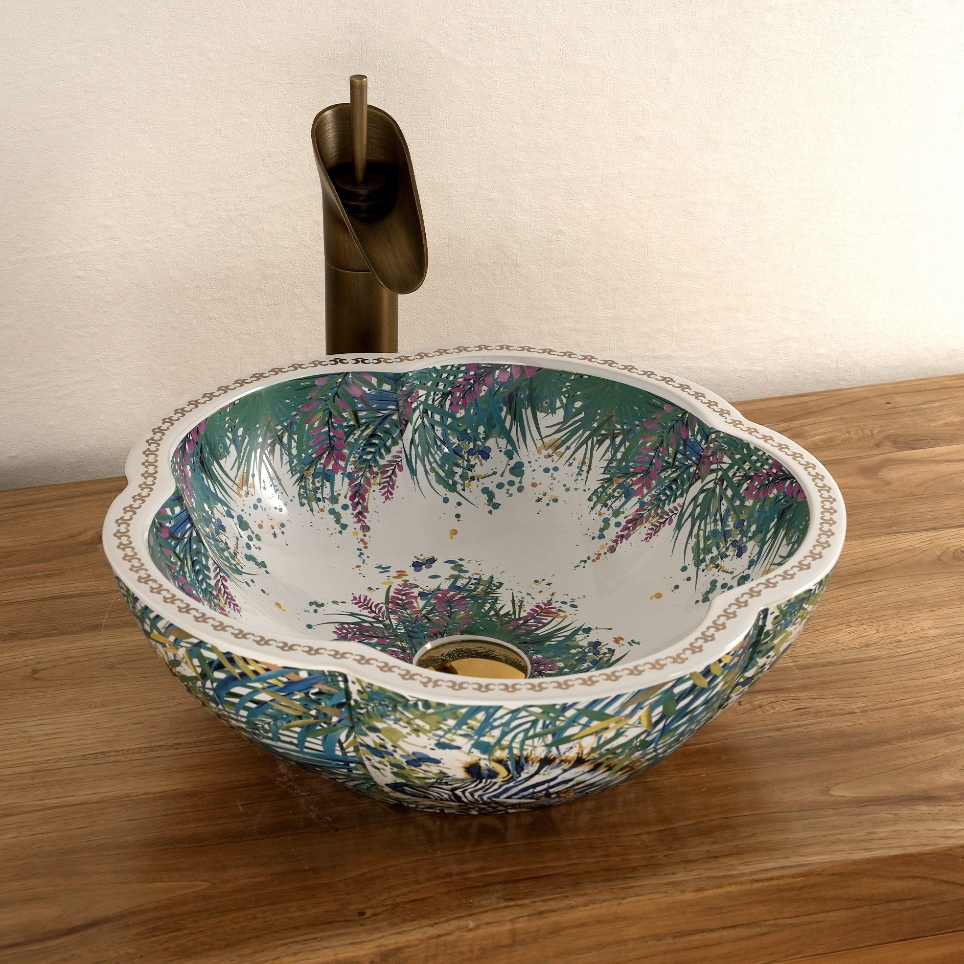 Ceramic washbasin with a green and white floral print