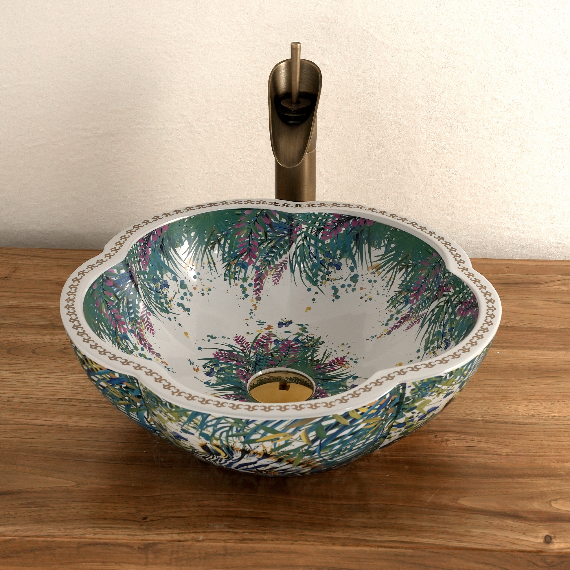 Ceramic washbasin with a green and white floral print