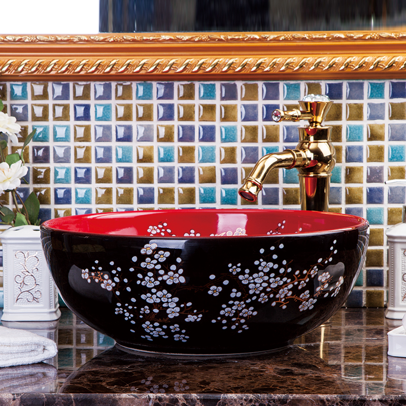 Washbasin with a red and black floral pattern