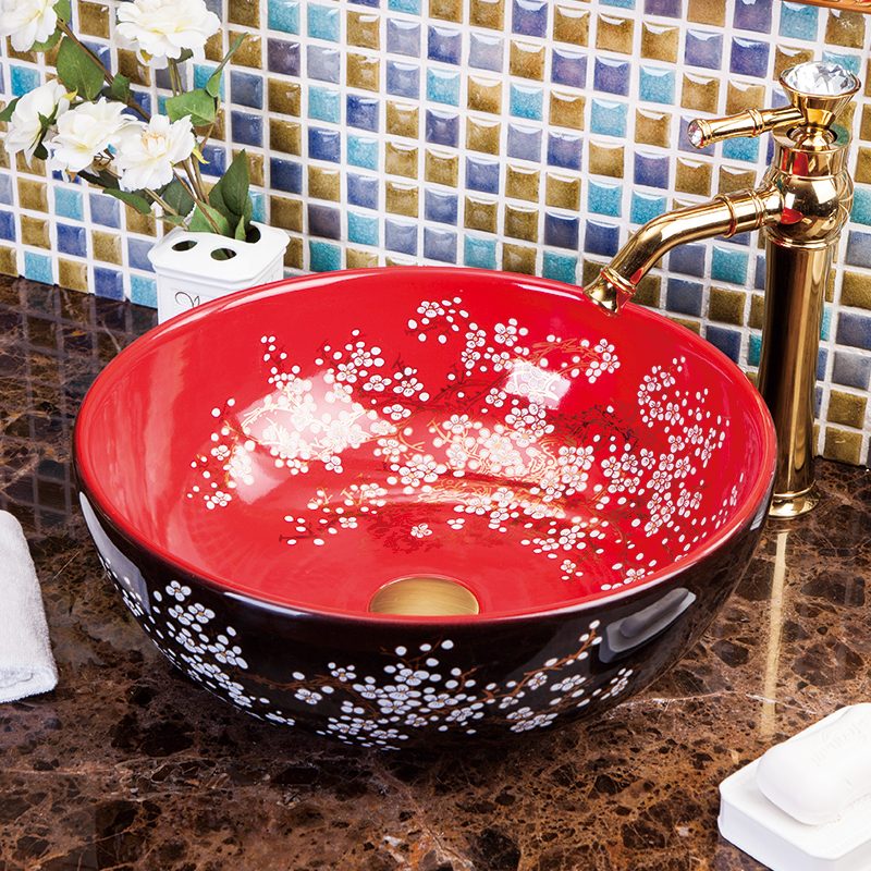 Washbasin with a red and black floral pattern
