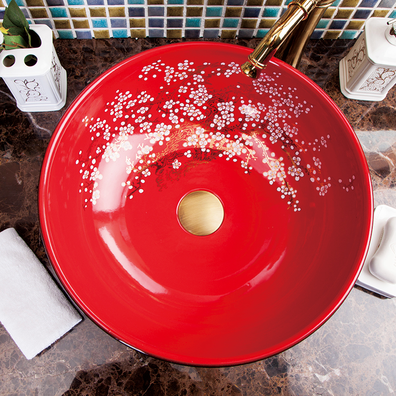 Washbasin with a red and black floral pattern