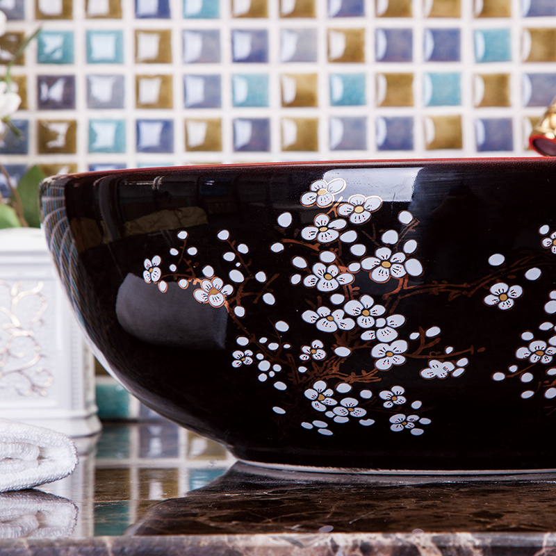 Washbasin with a red and black floral pattern