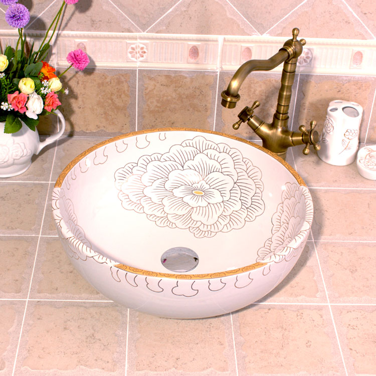 Washbasin with orange and white floral-patterned interior