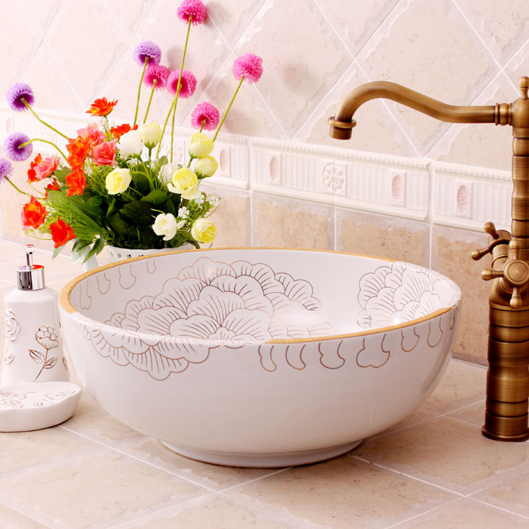 Washbasin with orange and white floral-patterned interior
