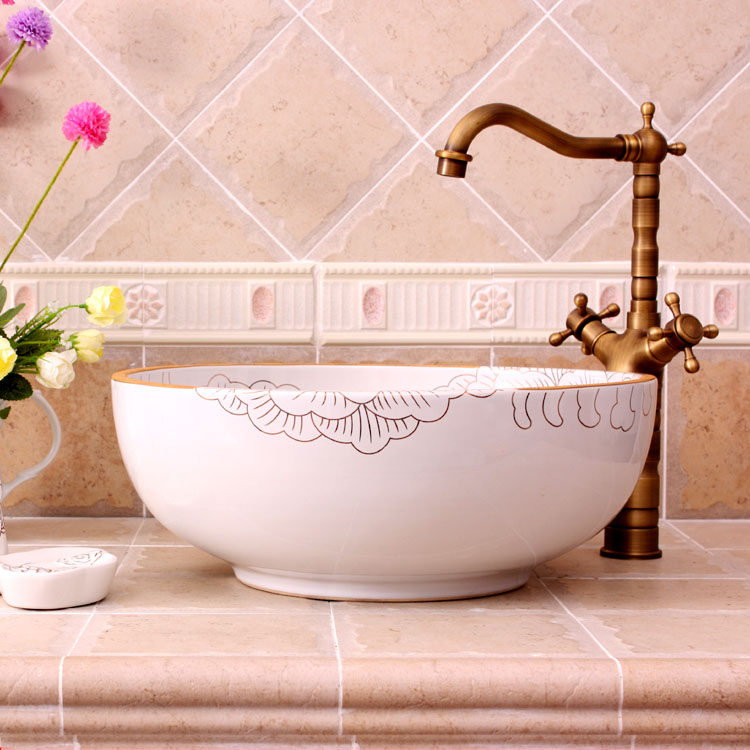Washbasin with orange and white floral-patterned interior