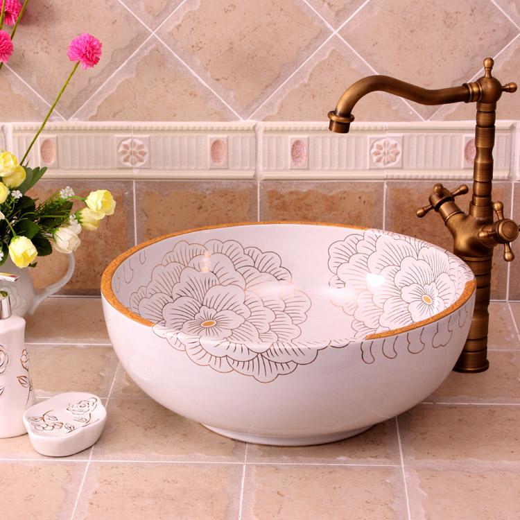 Washbasin with orange and white floral-patterned interior