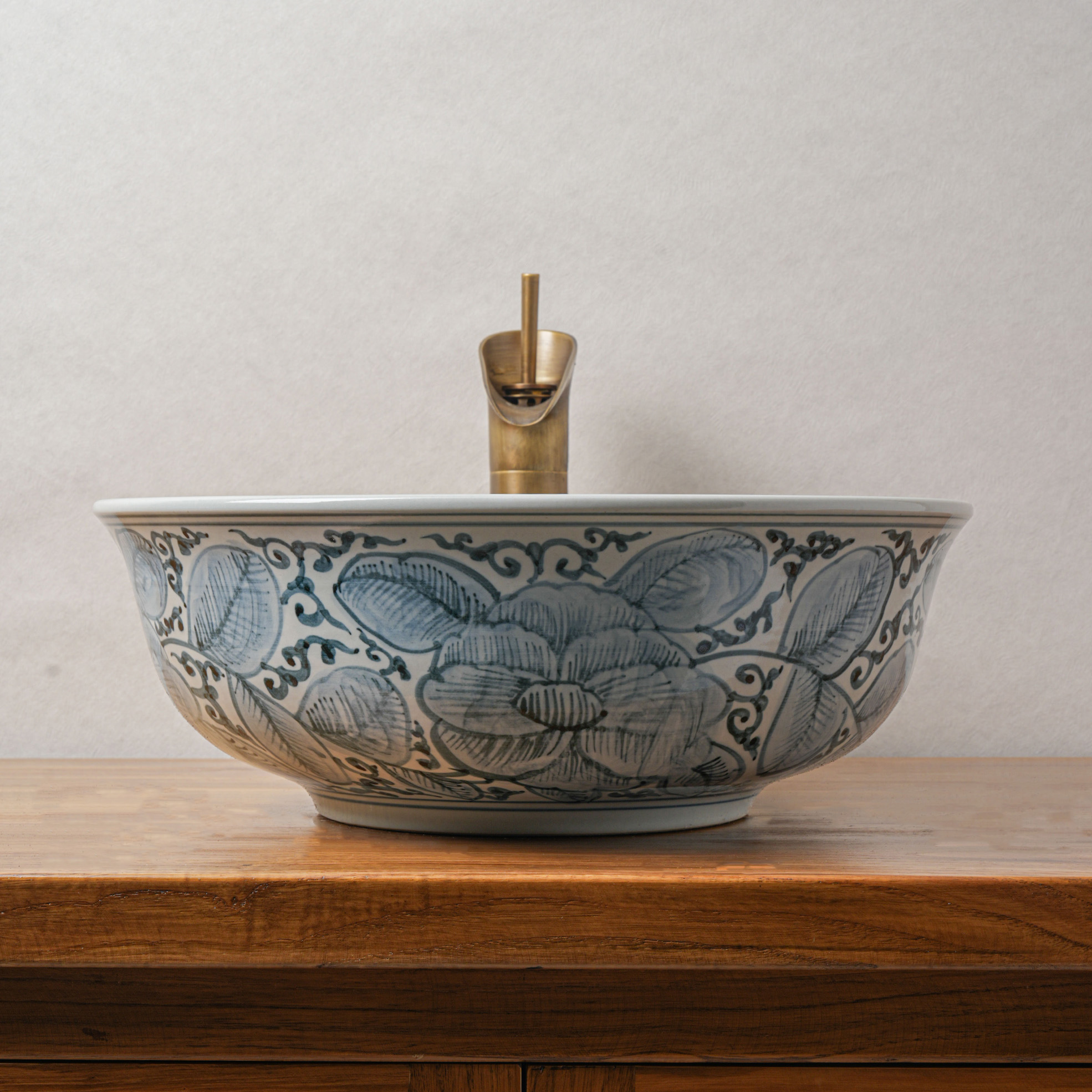 Round hand-painted ceramic washbasin