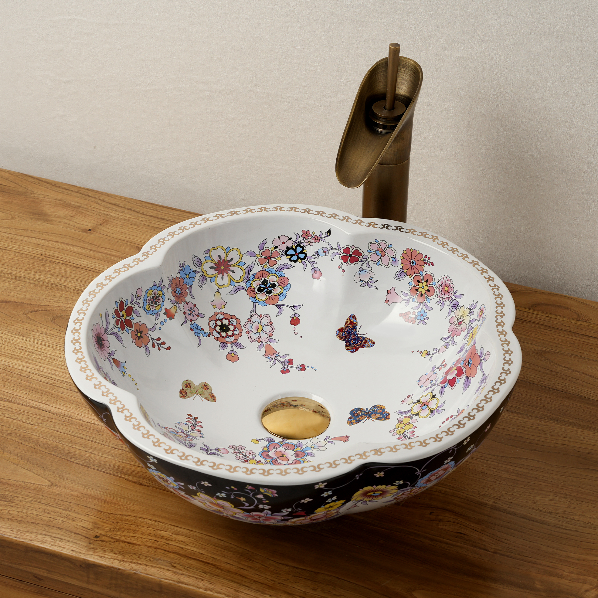 Ceramic washbasin with black and white floral print