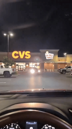Day and night car sun visor in use