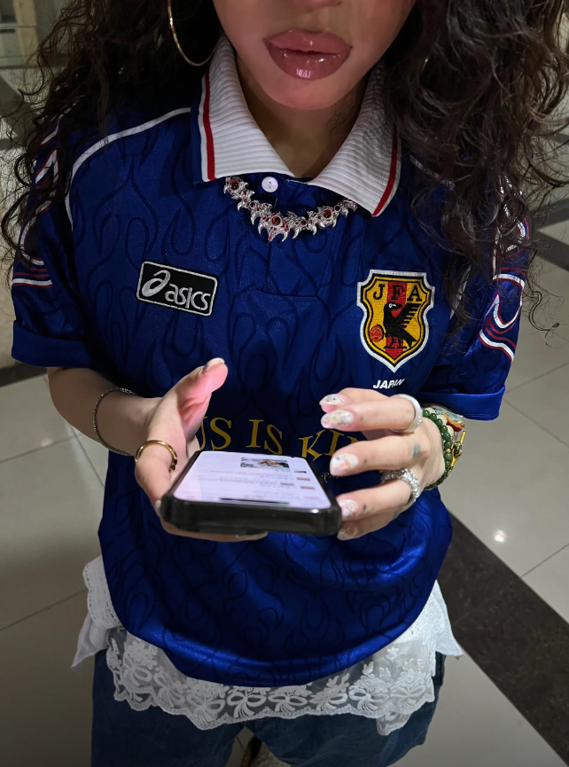 Sports Fan Kit customer wearing football jersey fan photo