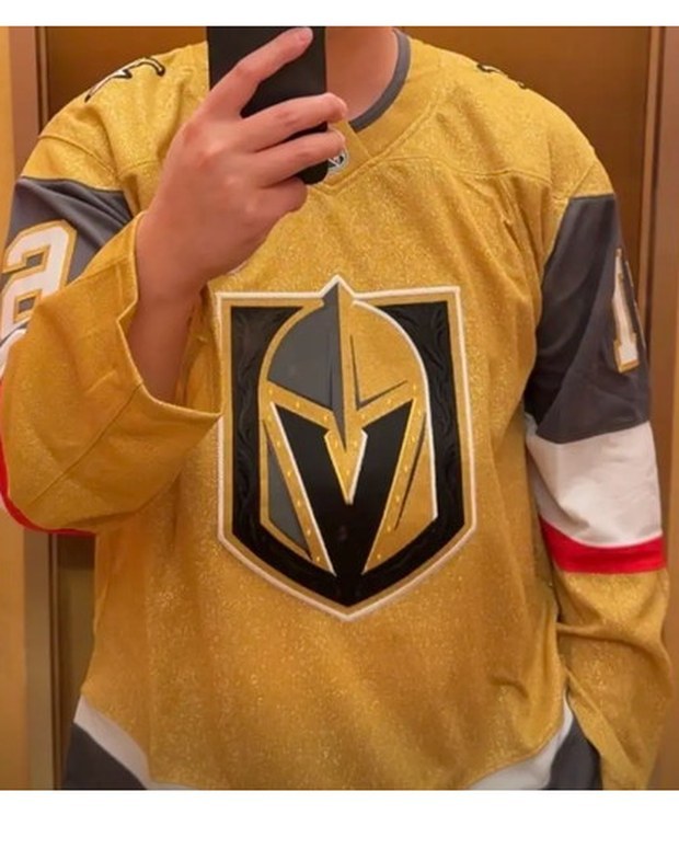 Customer photo of a gold hockey alternate jersey photographed in a mirror
