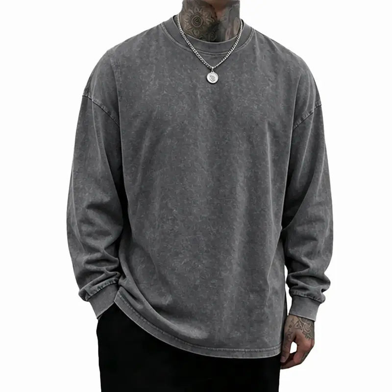 Crew neck and ribbed cuff details on washed long sleeve shirt