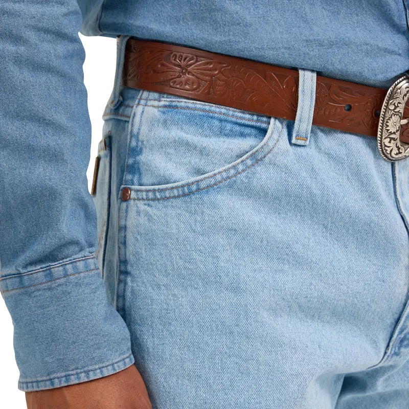 Light blue denim jeans showing classic front pocket, belt loop and denim construction