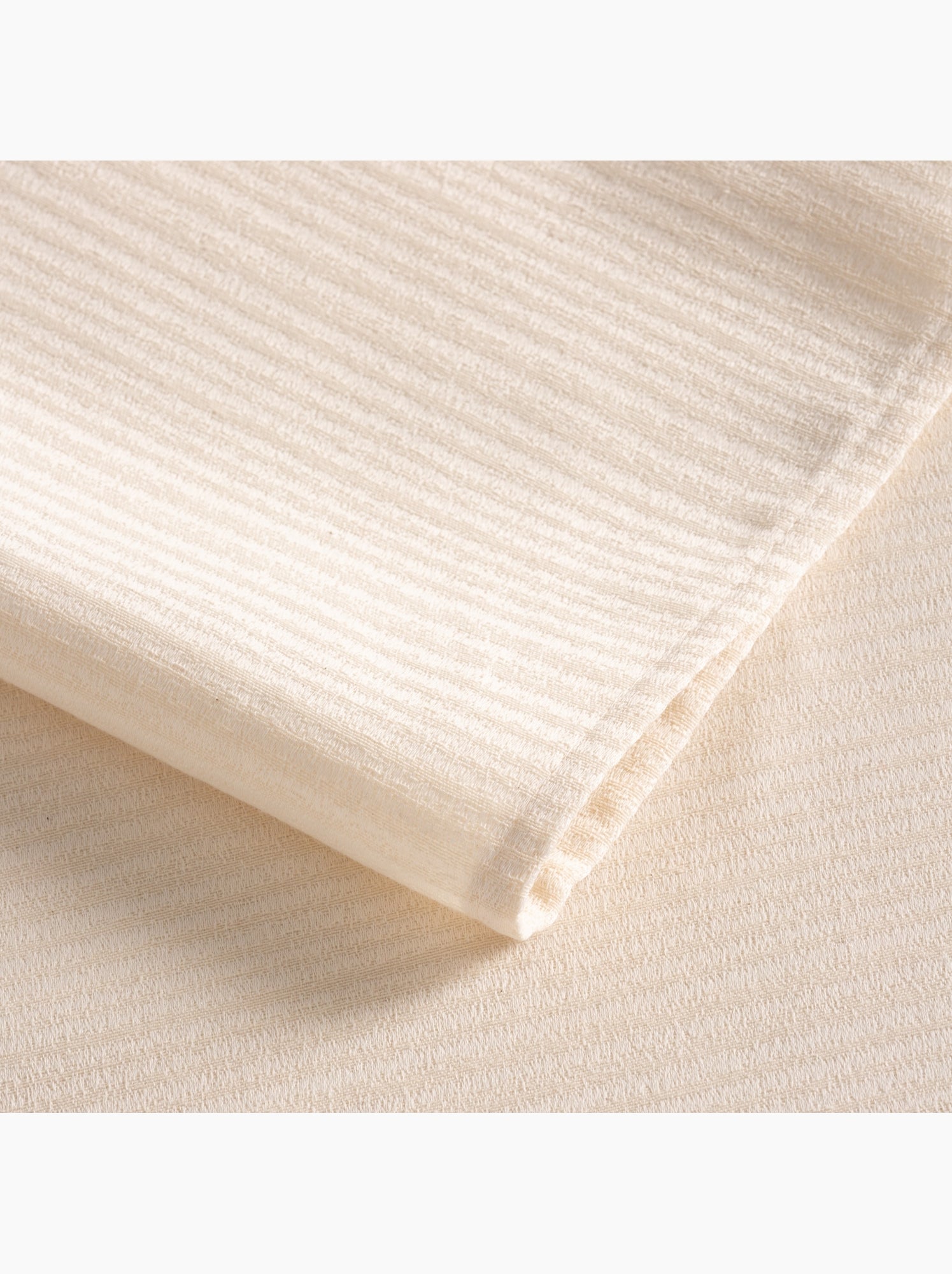 Nappe antitache avec tissu texturé à fines rayures - Gamusi. - Crème