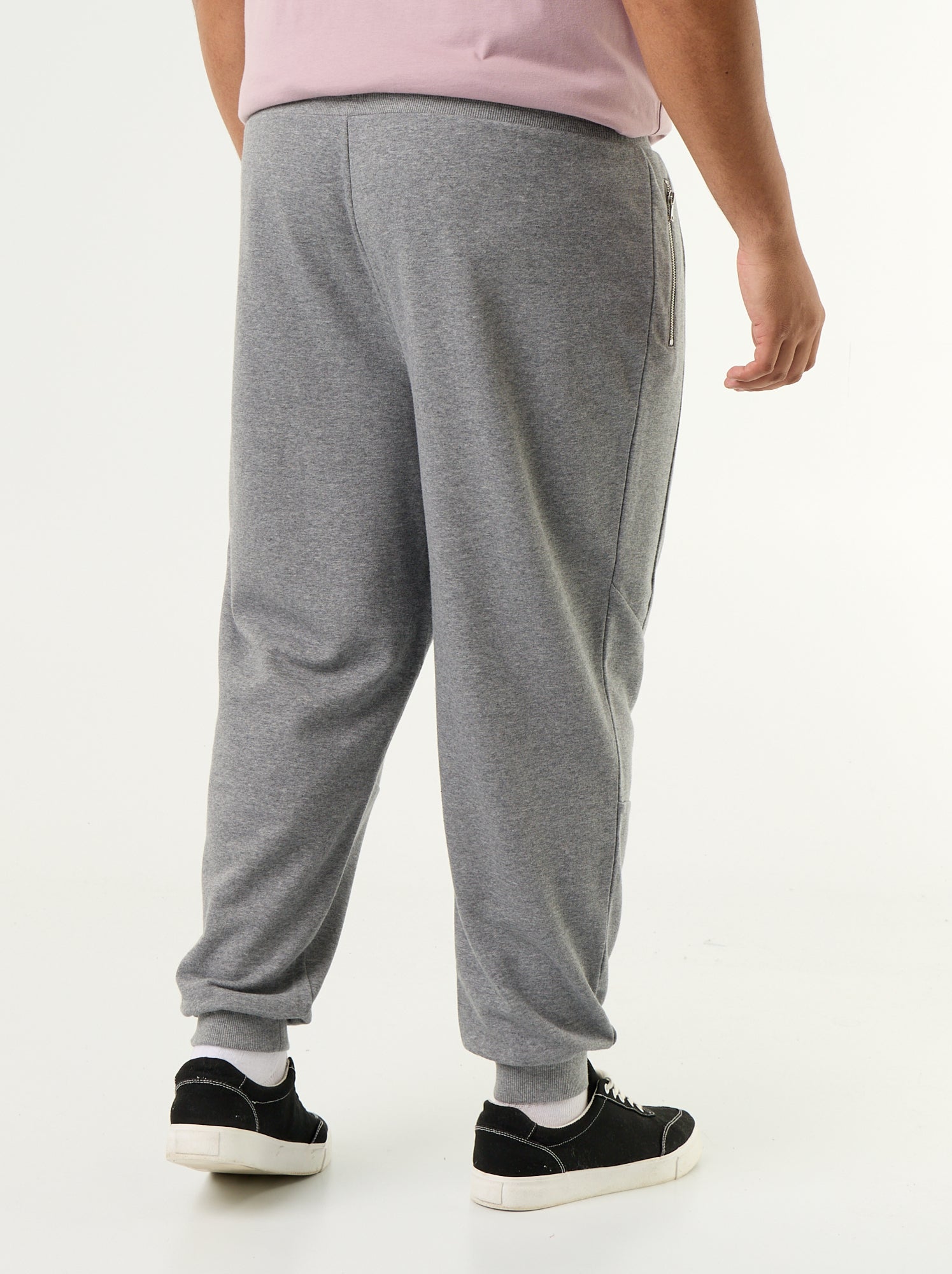 Pantalon de jogging avec bas resserré et poches zippées - Gris
