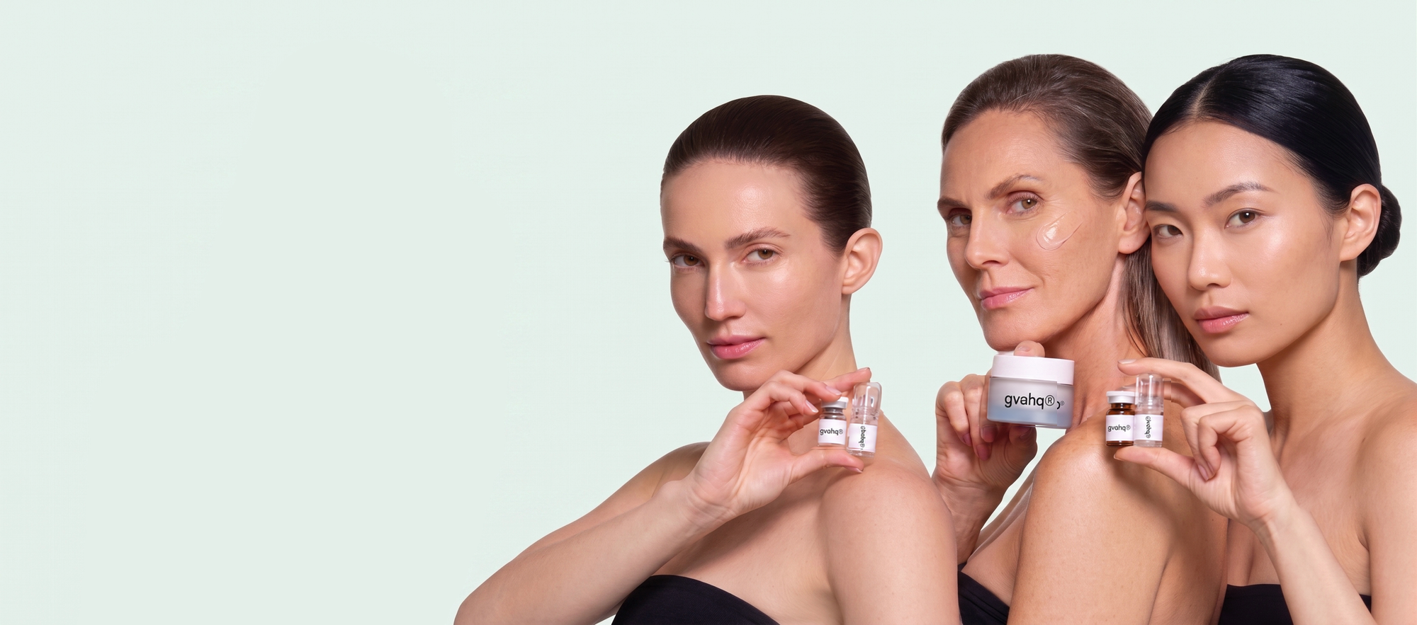 Skincare products presented by three models