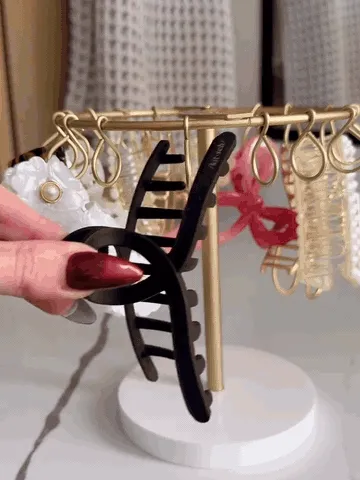 Claw clips being placed on and selected from the rotating organizer