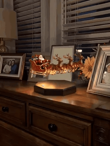 Santa sleigh floating above the magnetic base and being switched on