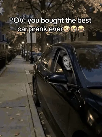 Scary face car headrest covers being slipped onto seats for a Halloween prank