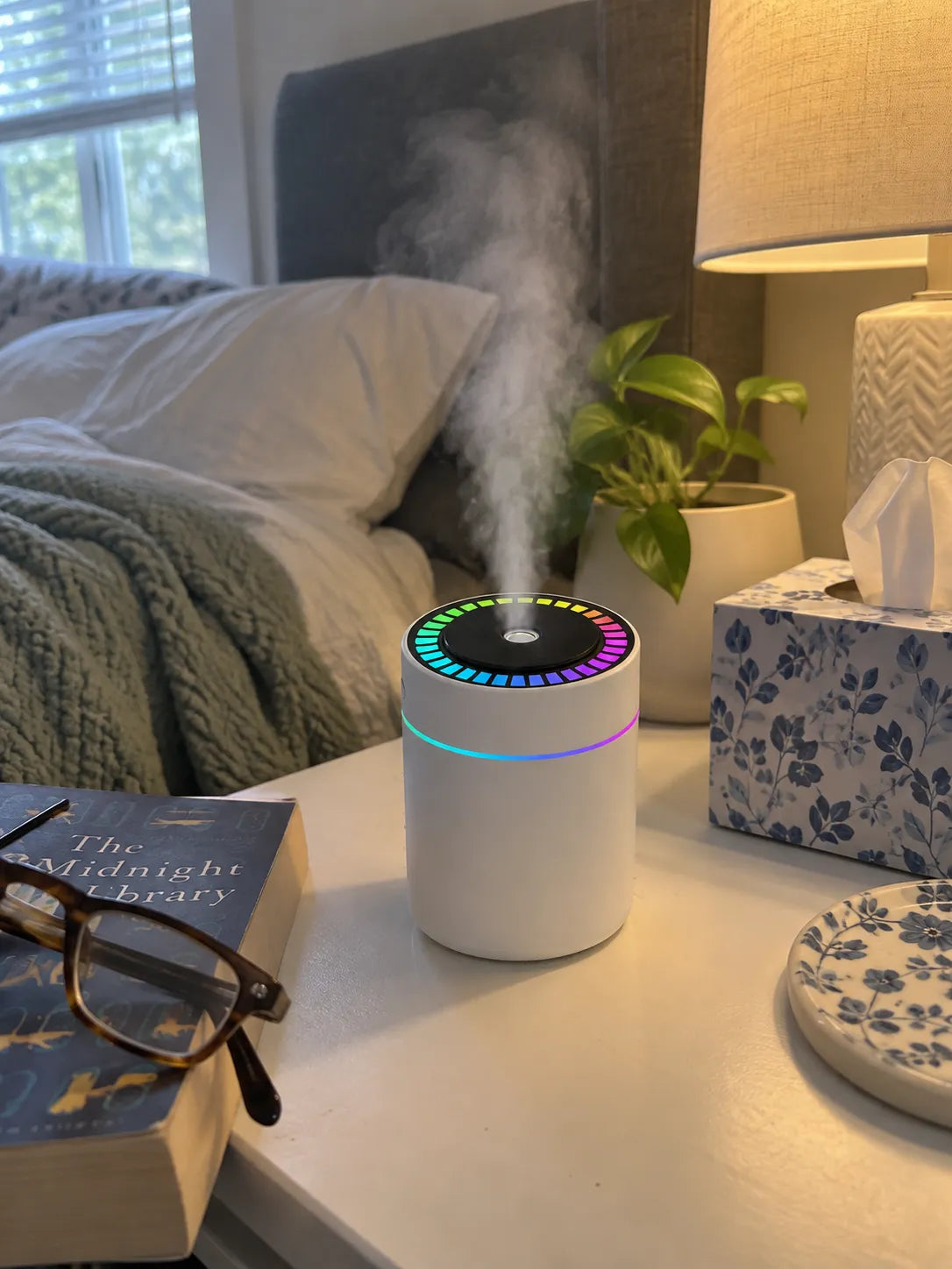 White humidifier on an everyday bedside table