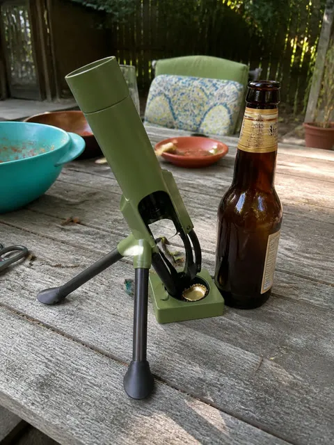 Opener and bottle on a backyard patio table