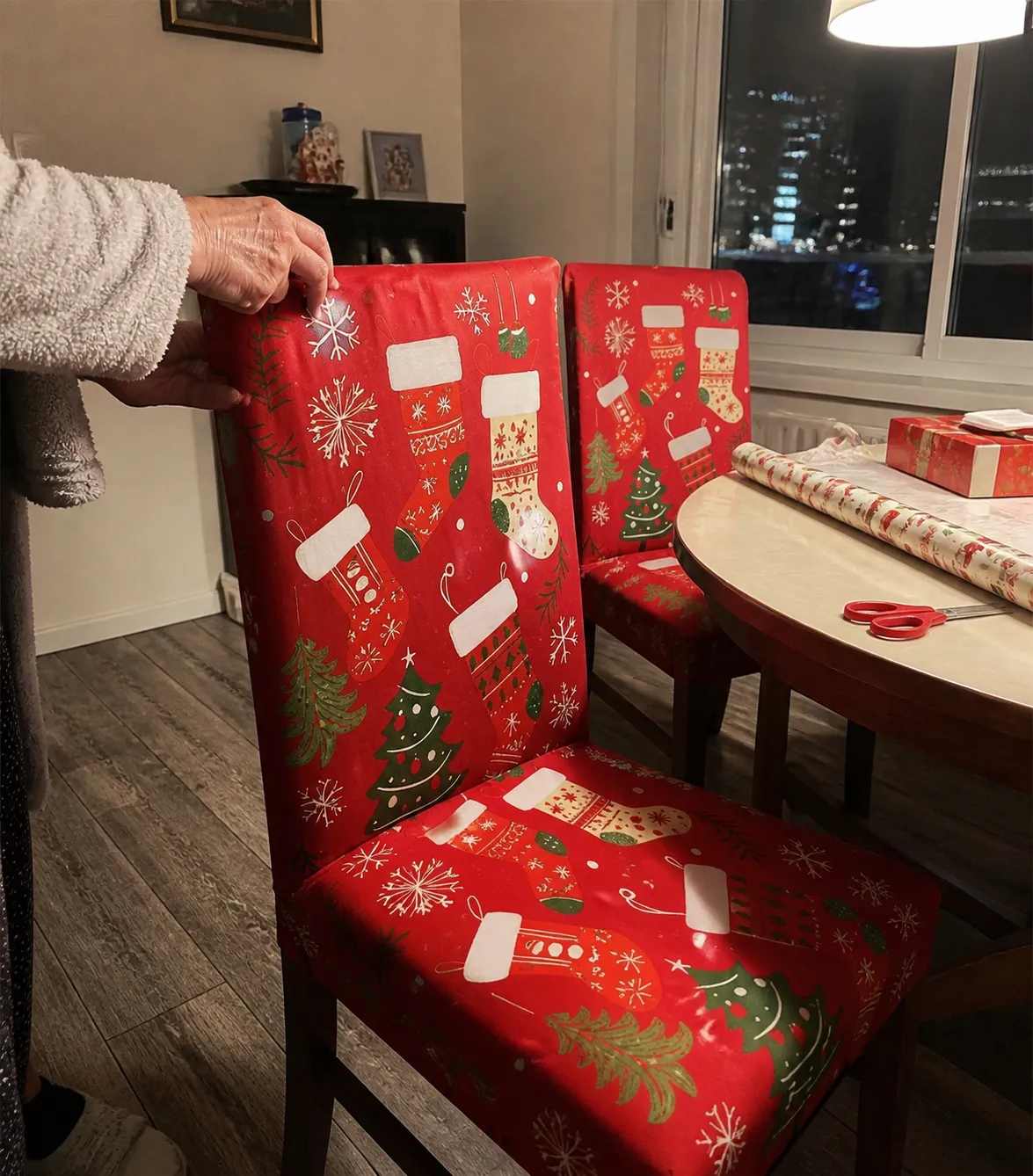 Two covered chairs in an apartment dining area