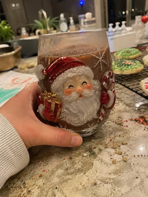Santa glass with cocoa on a family kitchen counter after cookie decorating