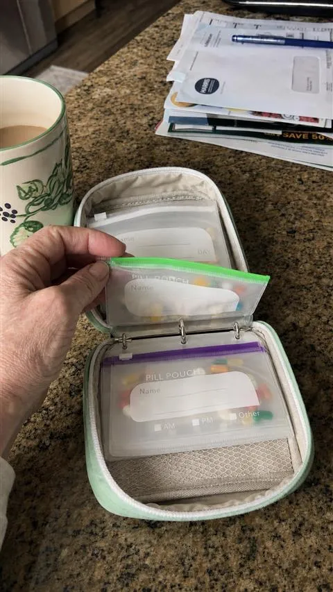 Organizer being flipped through on a kitchen counter