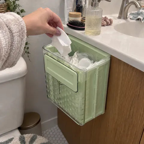Green foldable bin beside a bathroom vanity