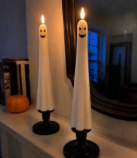 Devil face ghost candles on an apartment mantel