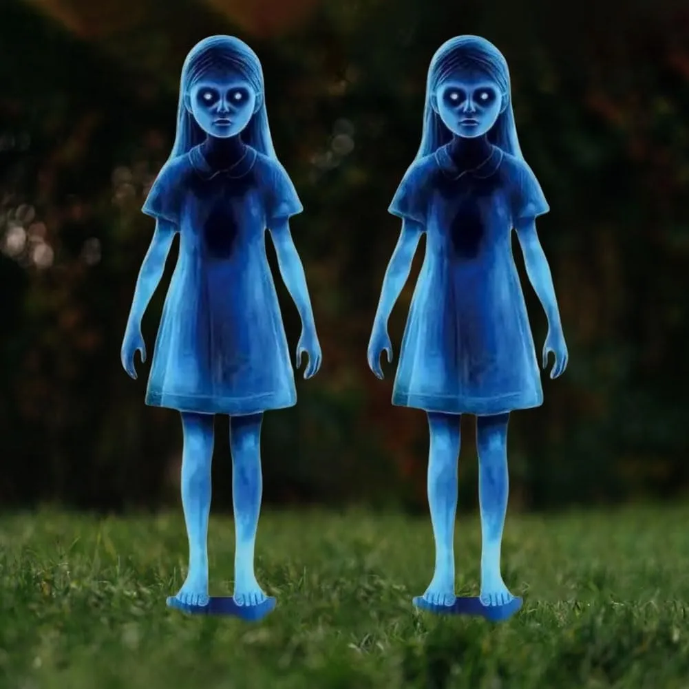 Close view of two matching blue ghost-girl lawn stakes