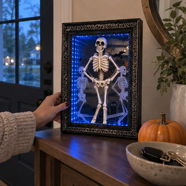 Skeleton infinity-mirror frame on a casual entryway console