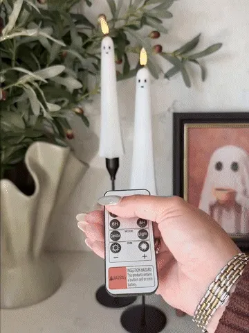 Flameless ghost candles being set up and controlled with the remote