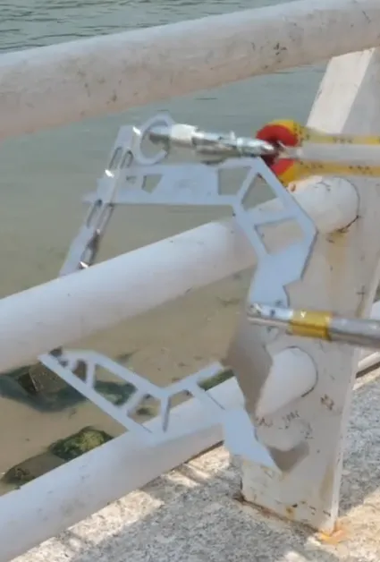 Boater using the smooth locking mechanism of a mooring hook