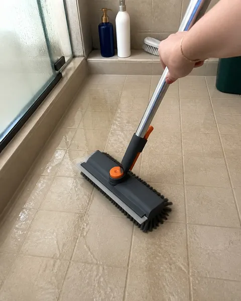 Floor brush cleaning wet shower tile