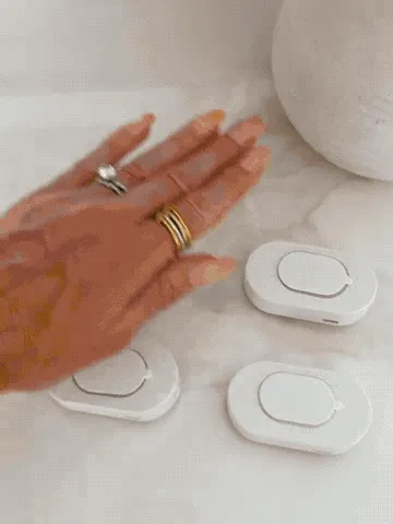 Motion sensor lights being placed and illuminating a dark walkway