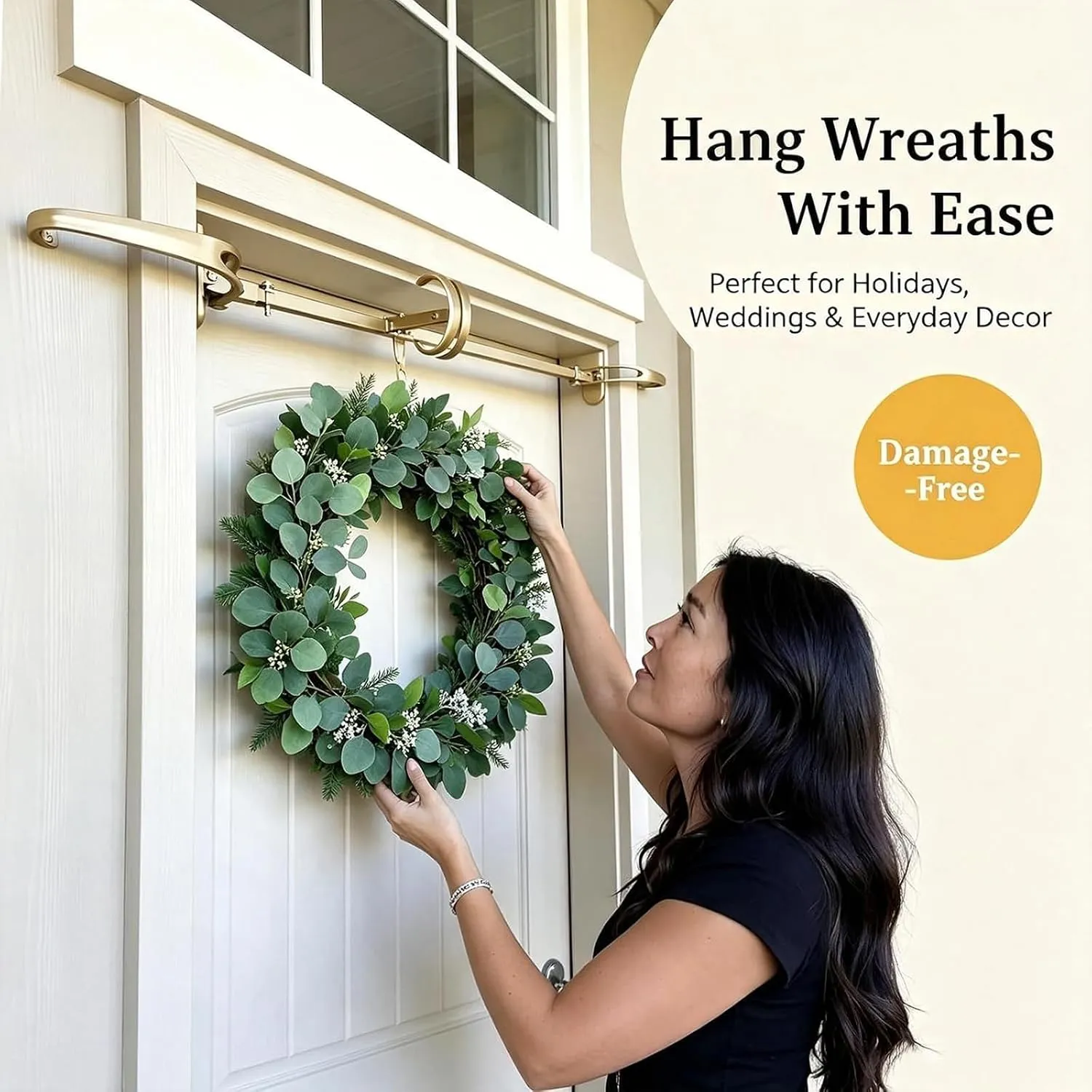 Woman hanging a wreath from the adjustable gold doorway hanger