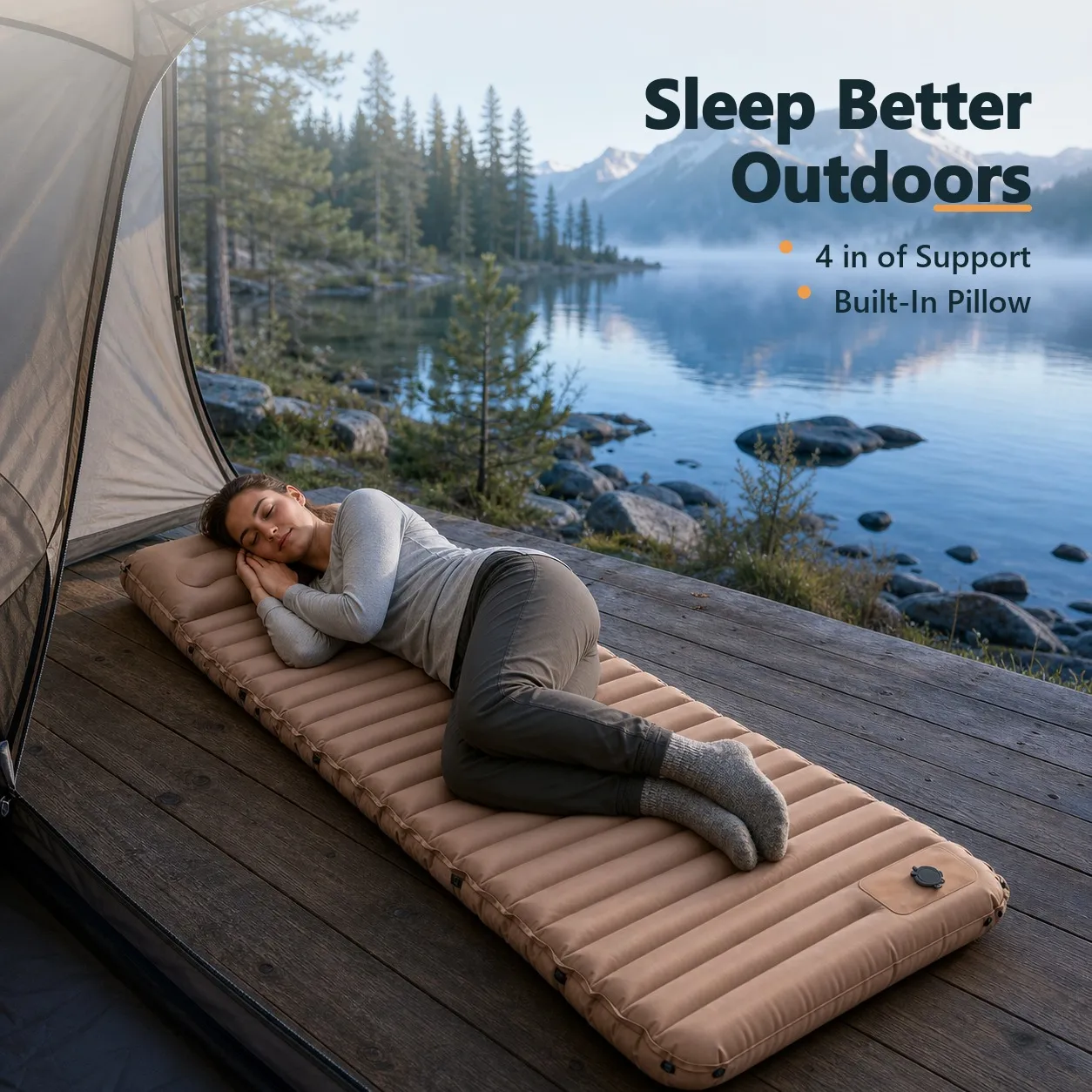 Side sleeper resting on the camping mattress at a lakeside campsite