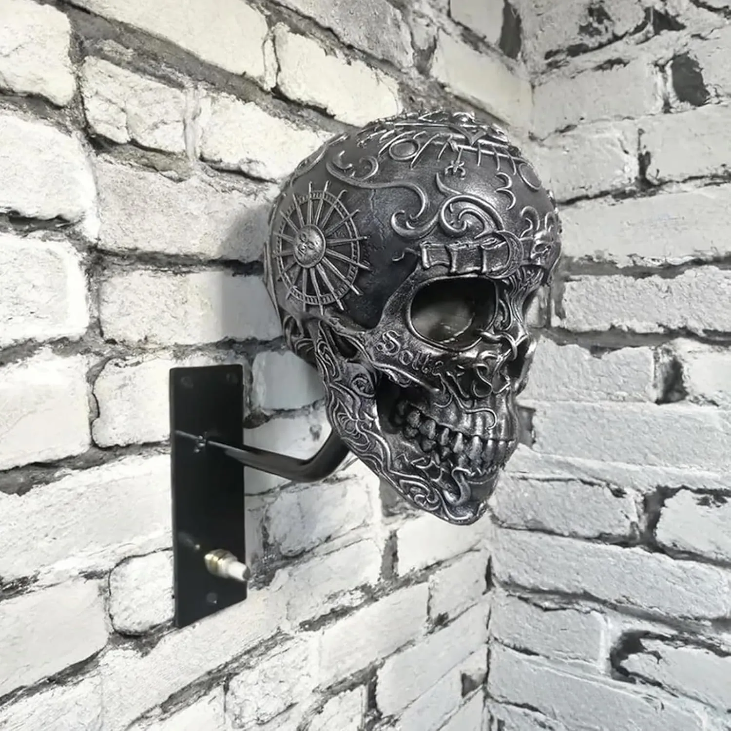 Steel silver skull helmet mount on a wall