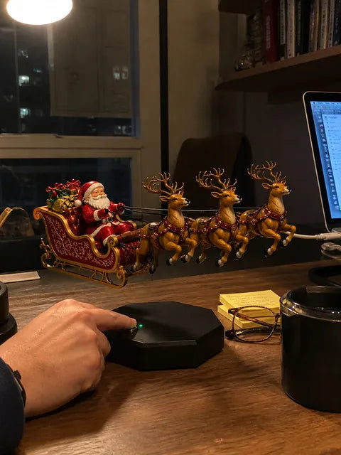 Floating Santa sleigh decoration on a casually cluttered home-office desk