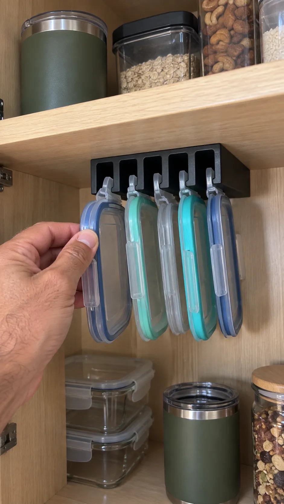 Black organizer in a compact RV kitchen cabinet