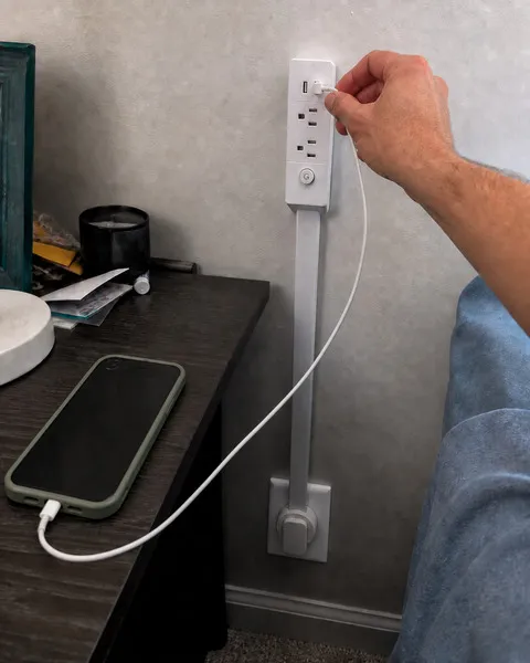 Bedroom nightstand with reachable outlet extender