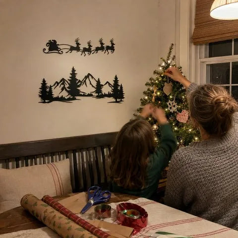 Family decorating beside the finished Santa and mountain wall display